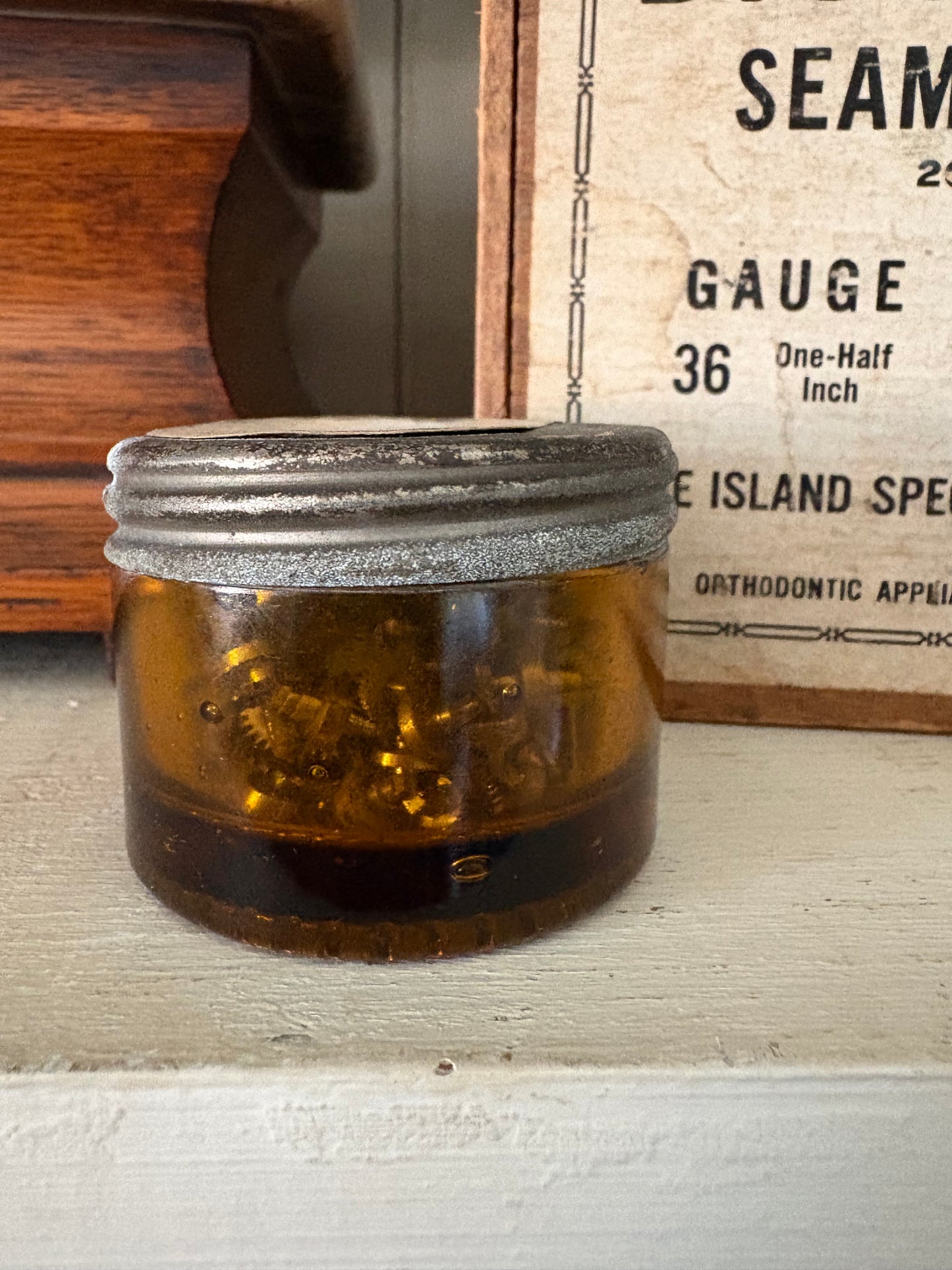 Antique small amber watch maker jar