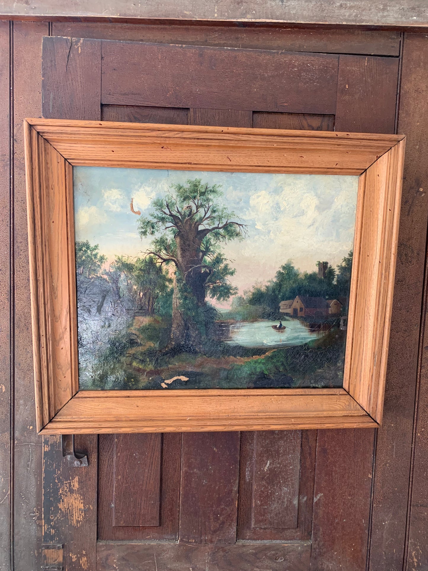 Large antique landscape painting on canvas in frame