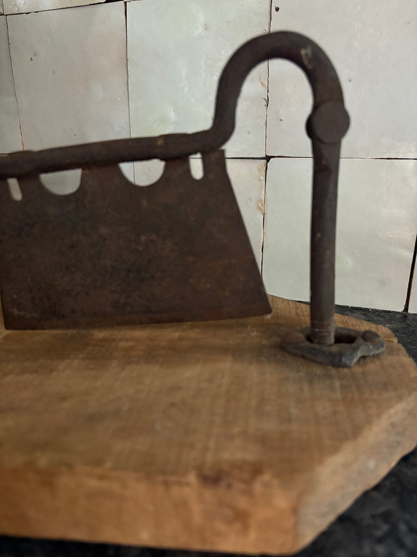 Antique iron & wood herb chopper on cutting board