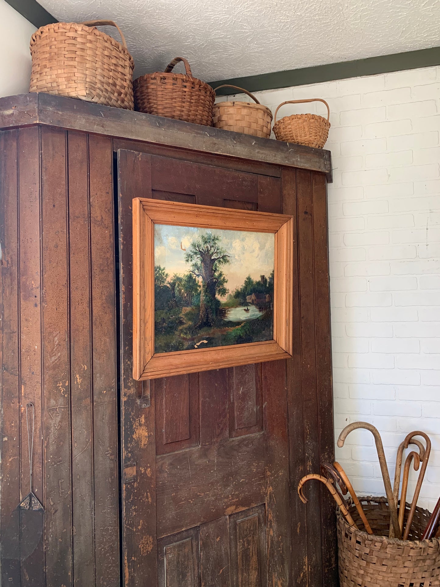 Large antique landscape painting on canvas in frame