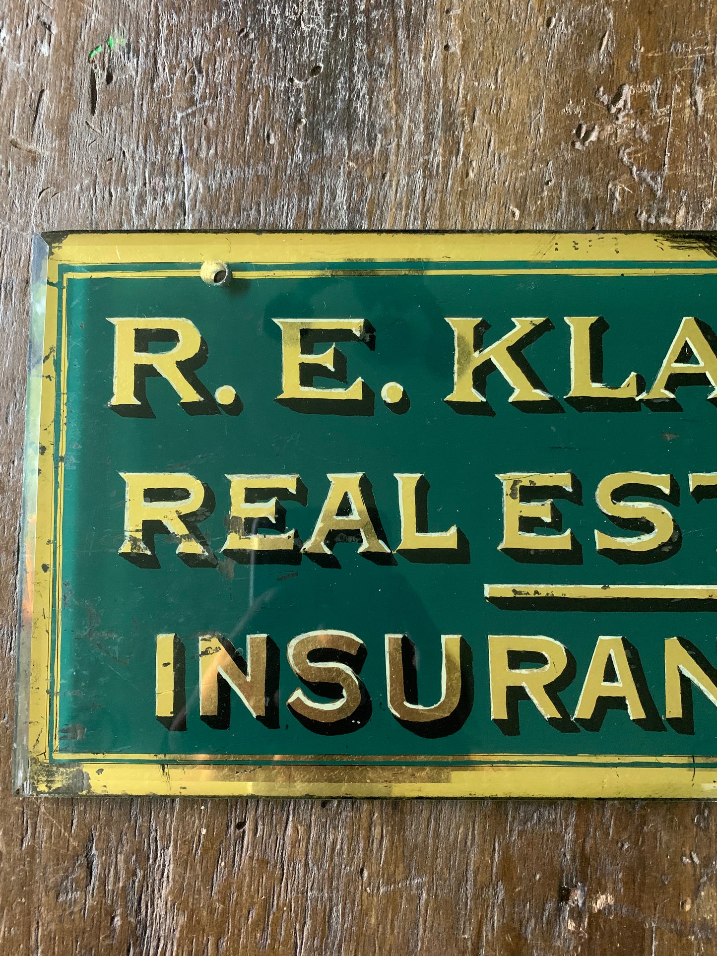 Antique painted glass trade sign| green & gilt