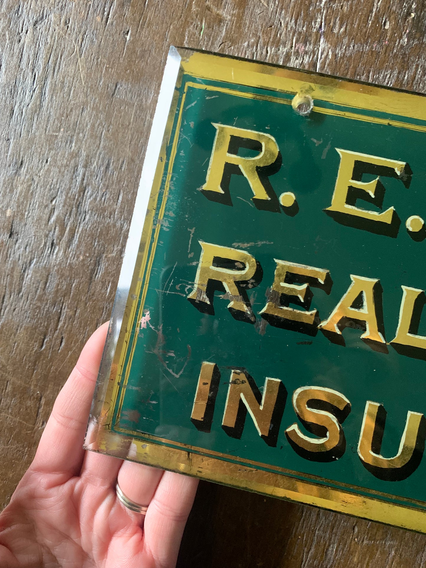 Antique painted glass trade sign| green & gilt
