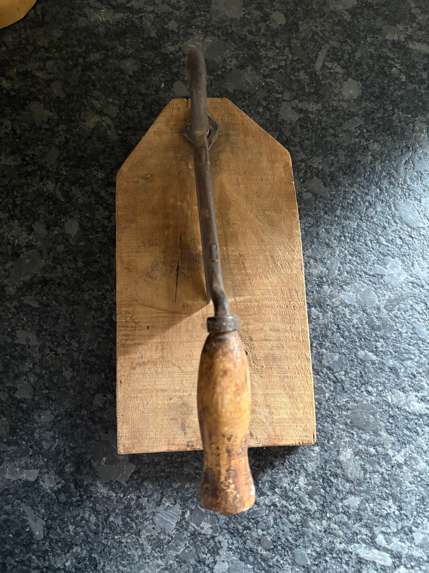 Antique iron & wood herb chopper on cutting board