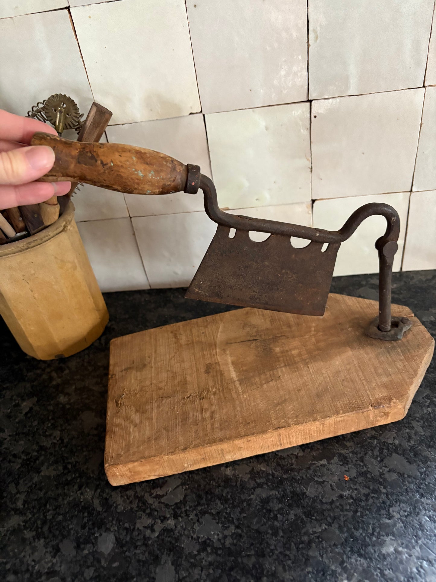 Antique iron & wood herb chopper on cutting board