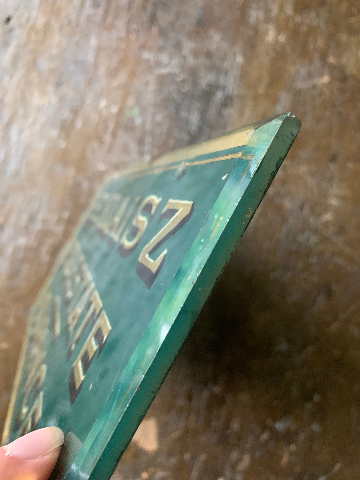 Antique painted glass trade sign| green & gilt