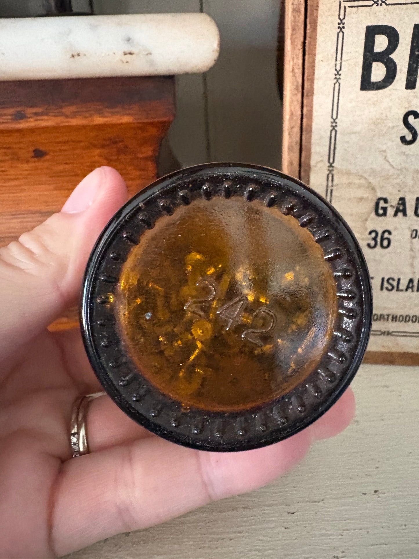 Antique small amber watch maker jar