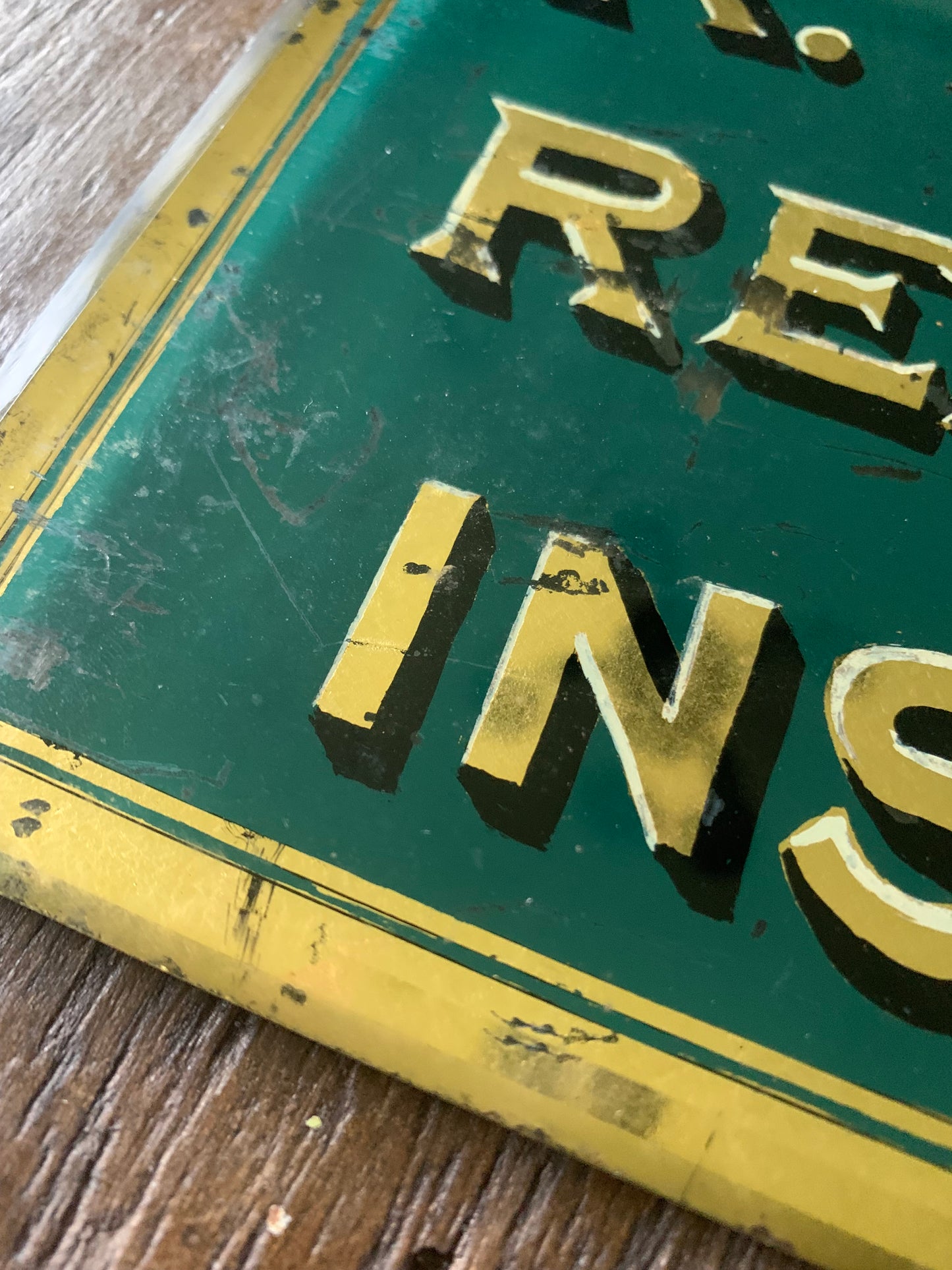 Antique painted glass trade sign| green & gilt
