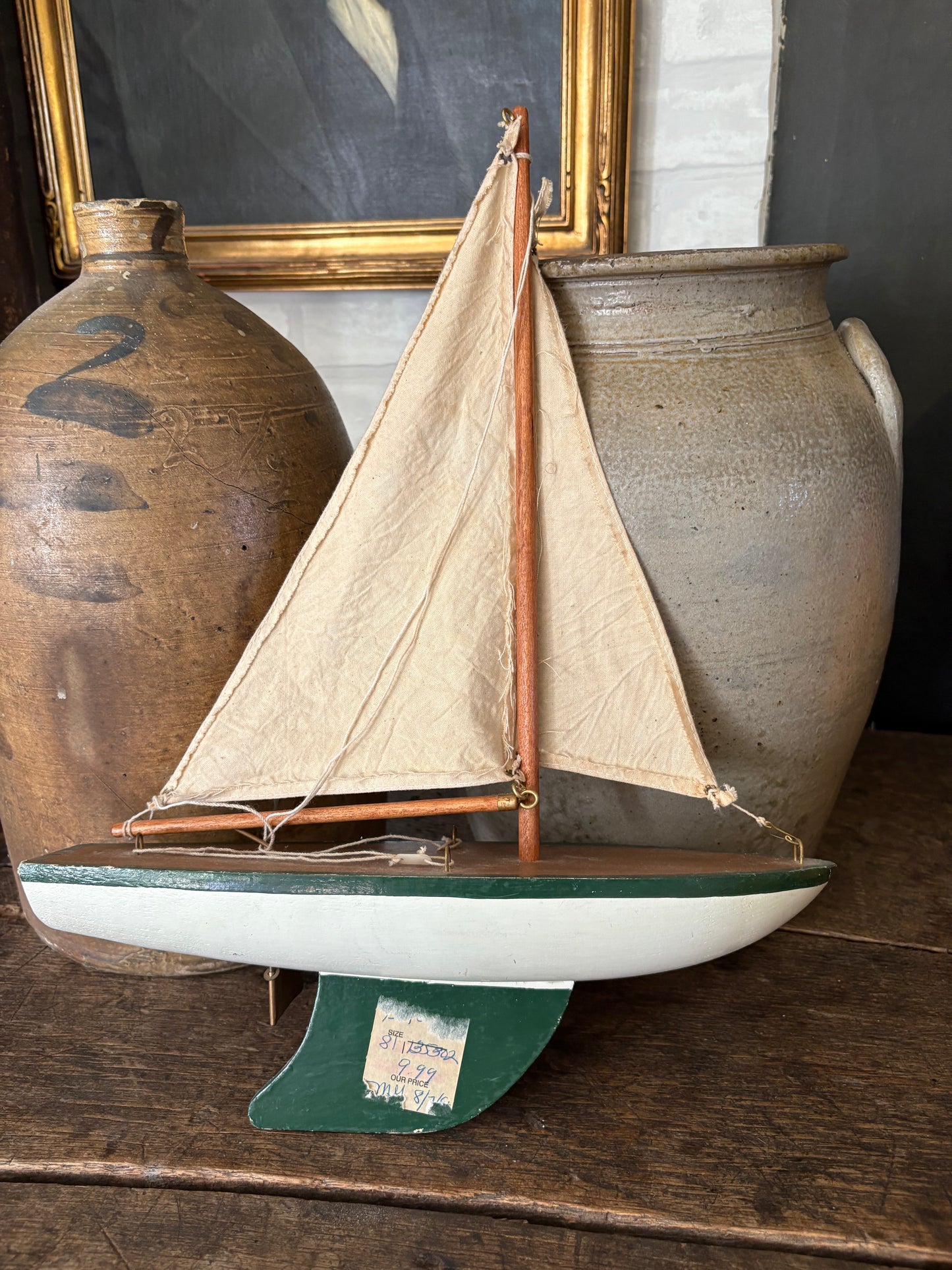 Vintage green wooden sailboat