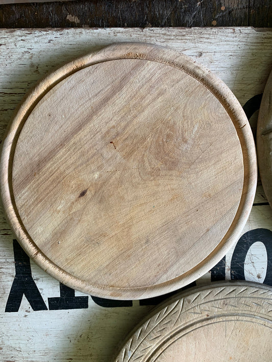 Vintage round wooden bread board