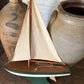Vintage green wooden sailboat