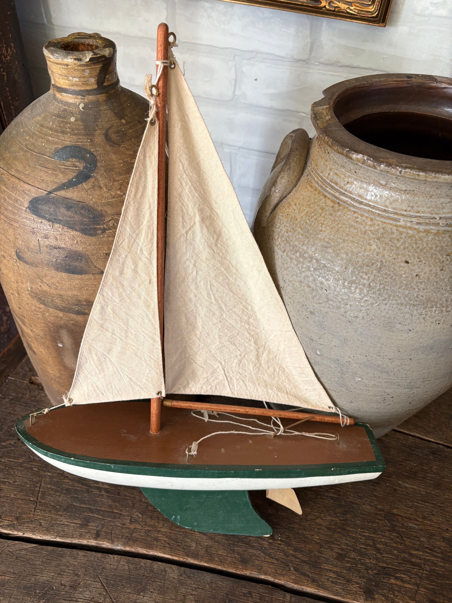 Vintage green wooden sailboat