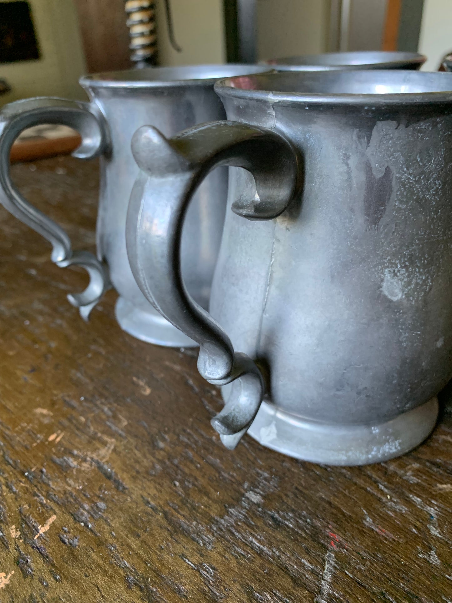 Colonial pewter tankard set of four