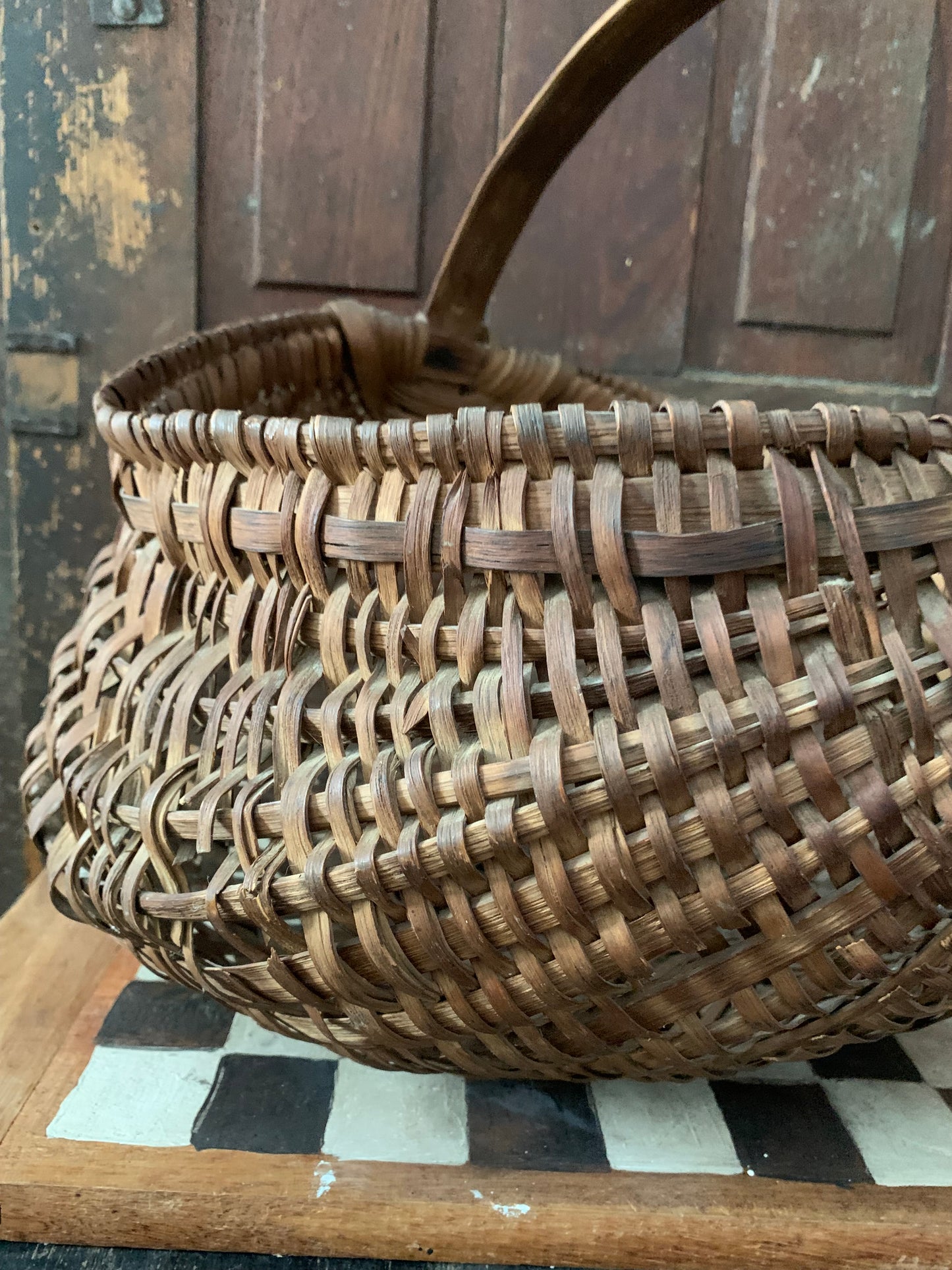 Antique primitive buttocks gathering basket