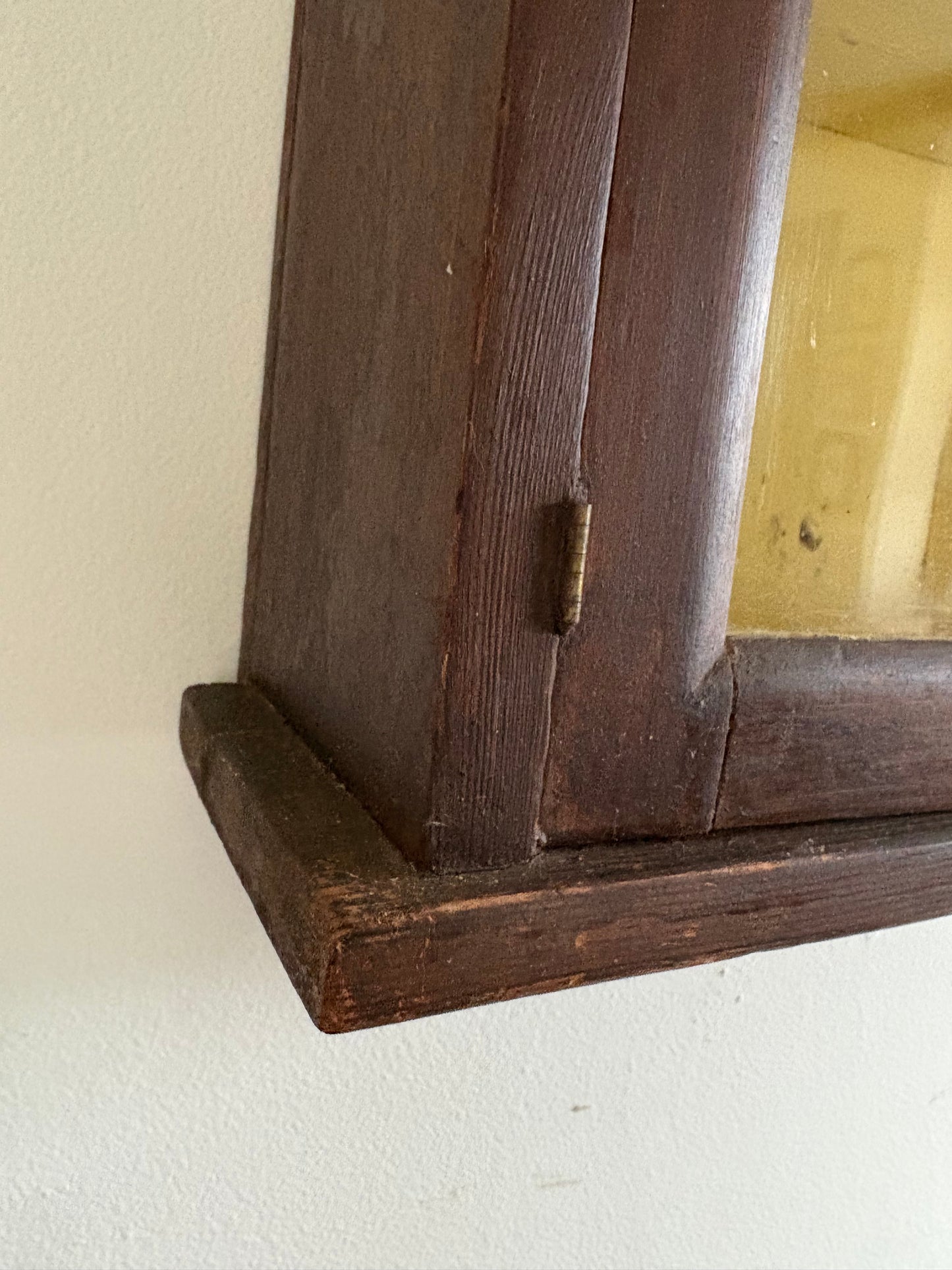 Antique early primitive wall cabinet with scallops