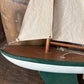 Vintage green wooden sailboat