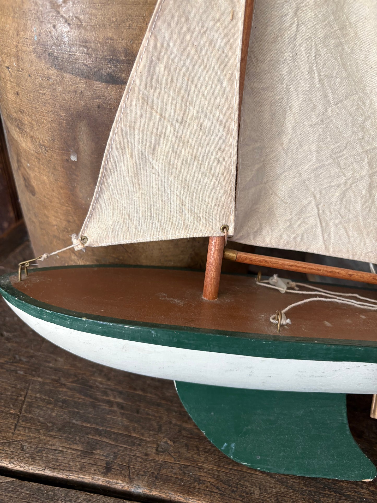 Vintage green wooden sailboat