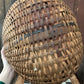 Antique primitive buttocks gathering basket