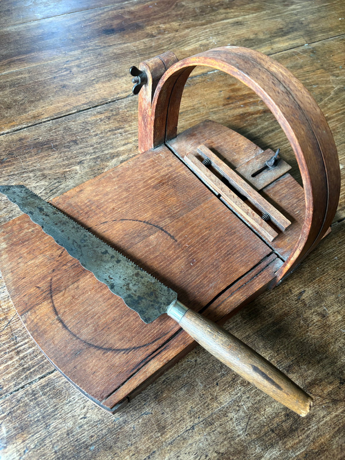 Antique wooden bread slicer with bread knife