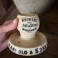 Antique advertising match strike and holder