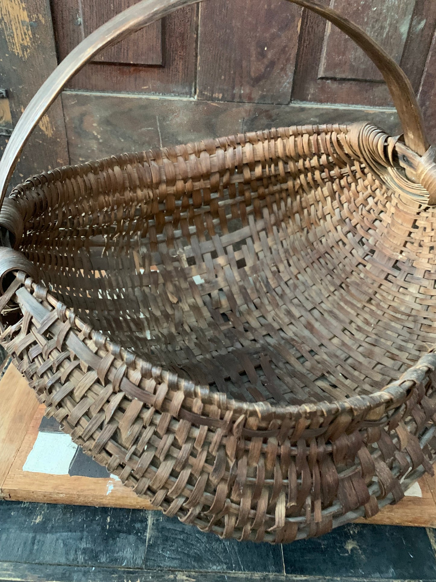 Antique primitive buttocks gathering basket