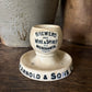 Antique advertising match strike and holder