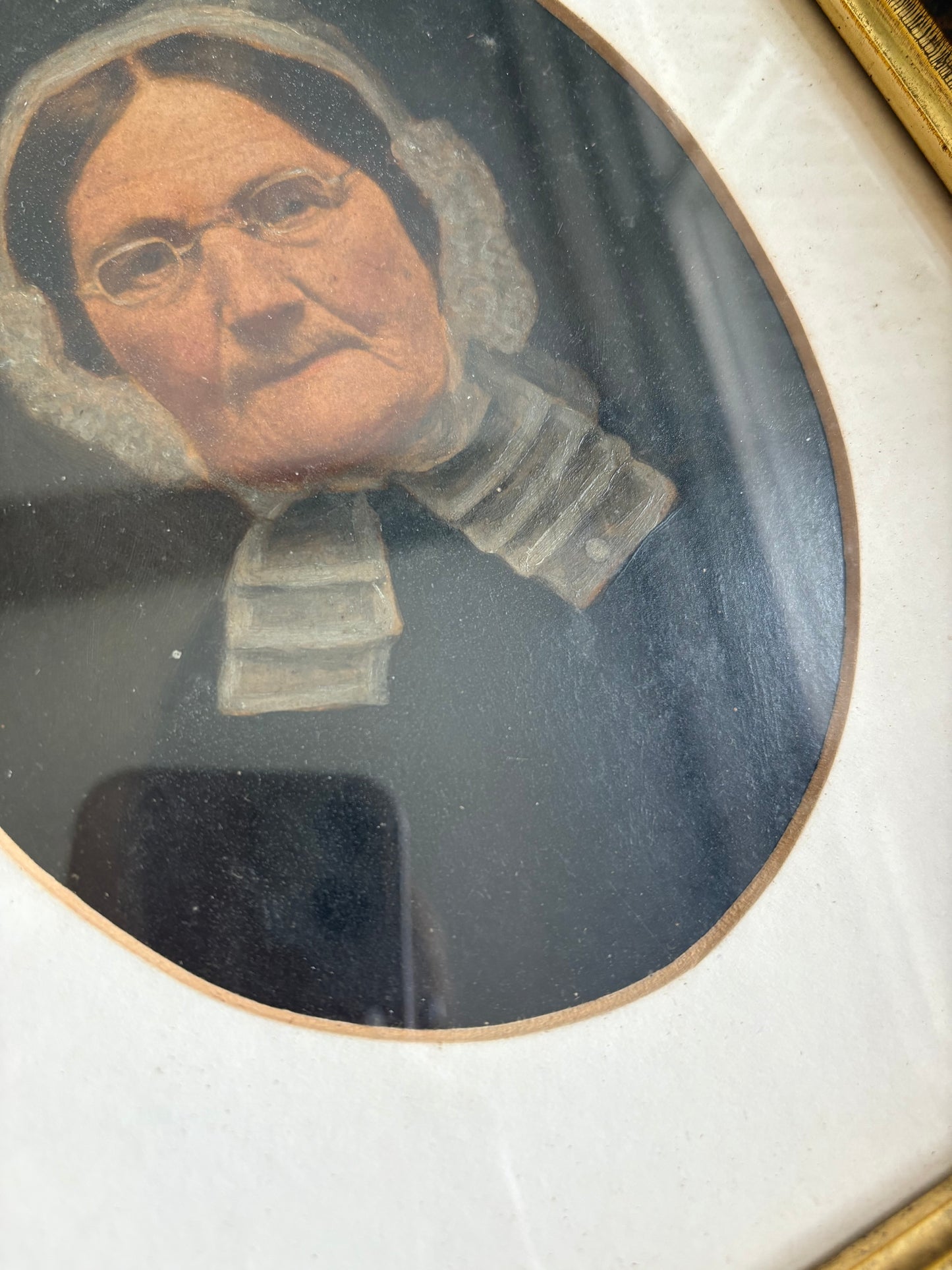 Antique oil painting of woman in frame