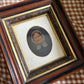 Antique oil painting of woman in frame