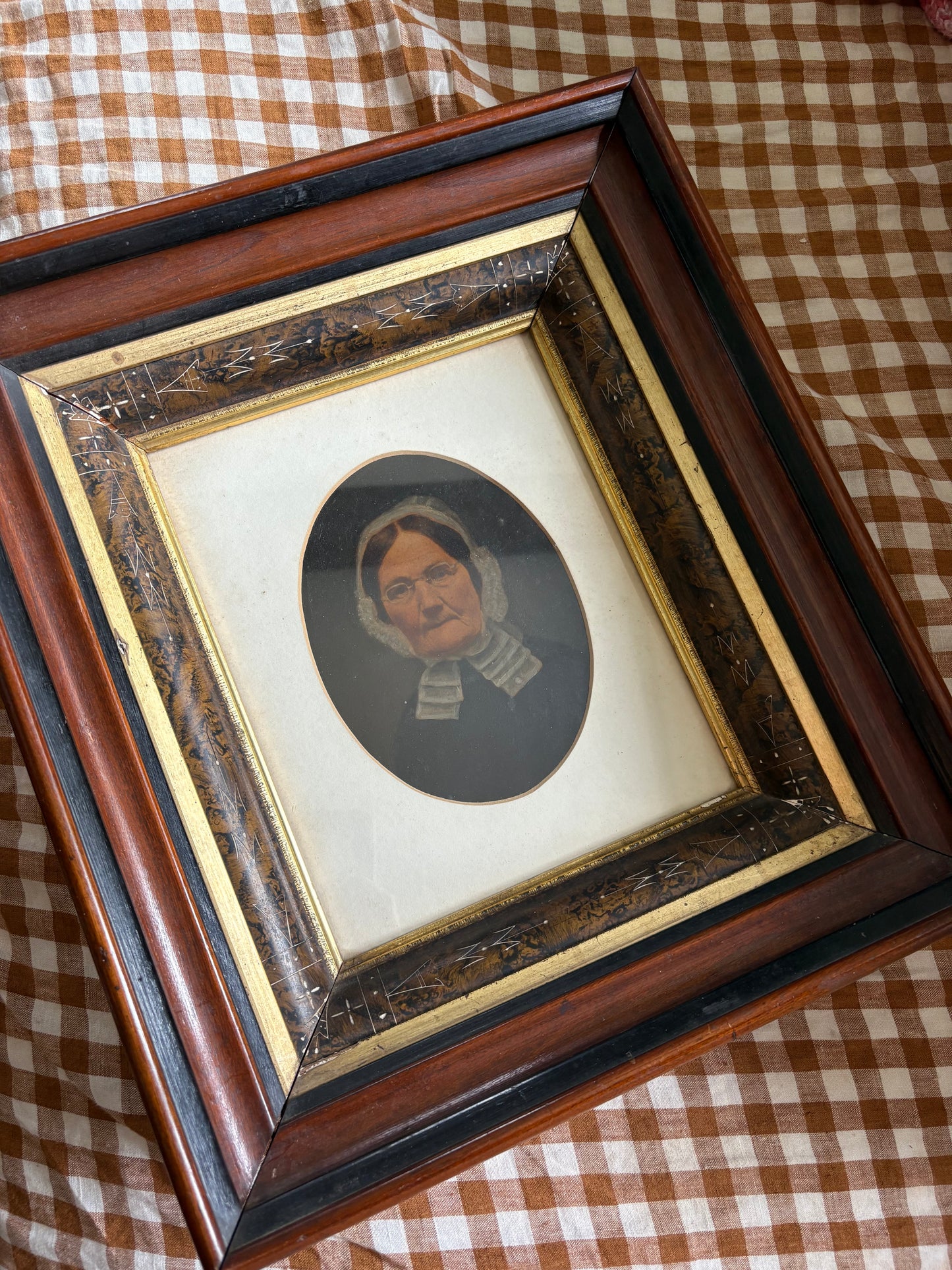 Antique oil painting of woman in frame