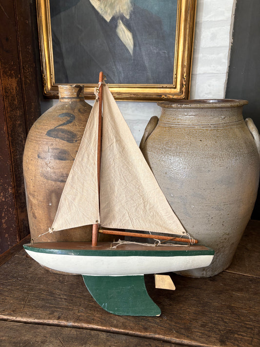 Vintage green wooden sailboat