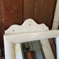 Antique small scalloped mirrored cabinet