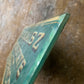 Antique painted glass trade sign| green & gilt