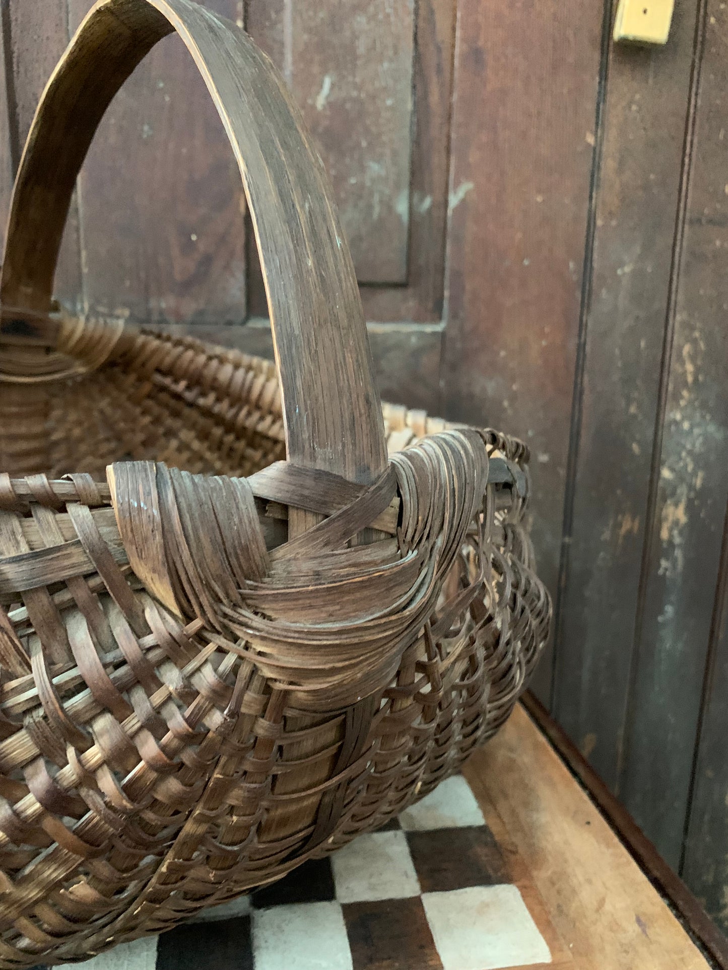 Antique primitive buttocks gathering basket