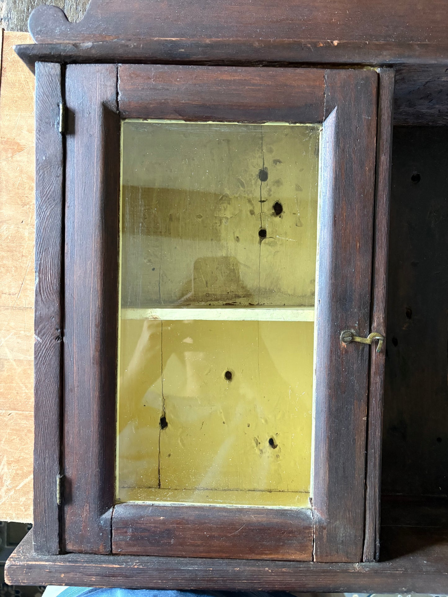 Antique early primitive wall cabinet with scallops