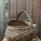 Antique primitive buttocks gathering basket