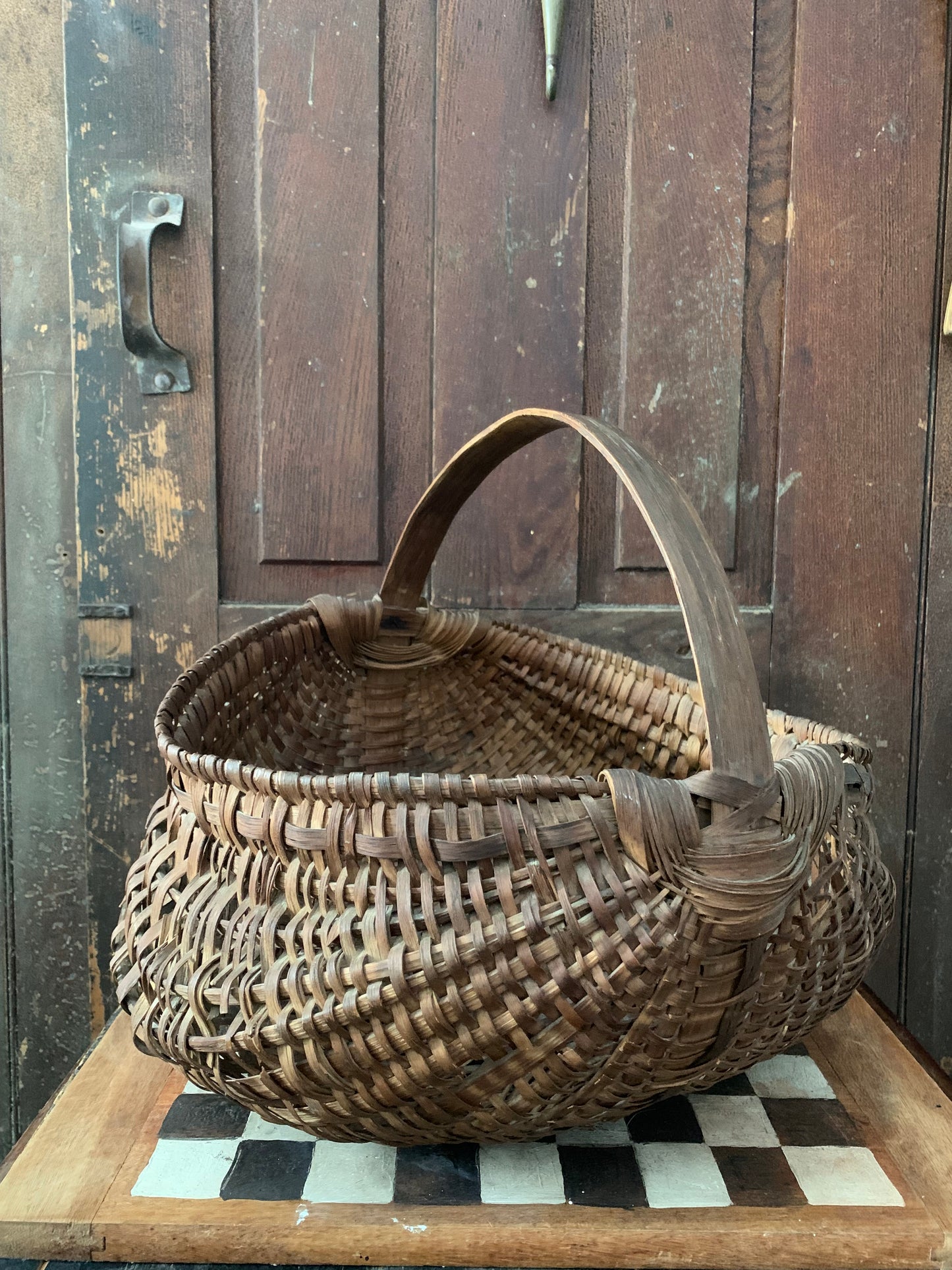 Antique primitive buttocks gathering basket