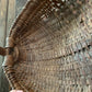 Antique primitive buttocks gathering basket