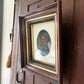 Antique oil painting of woman in frame