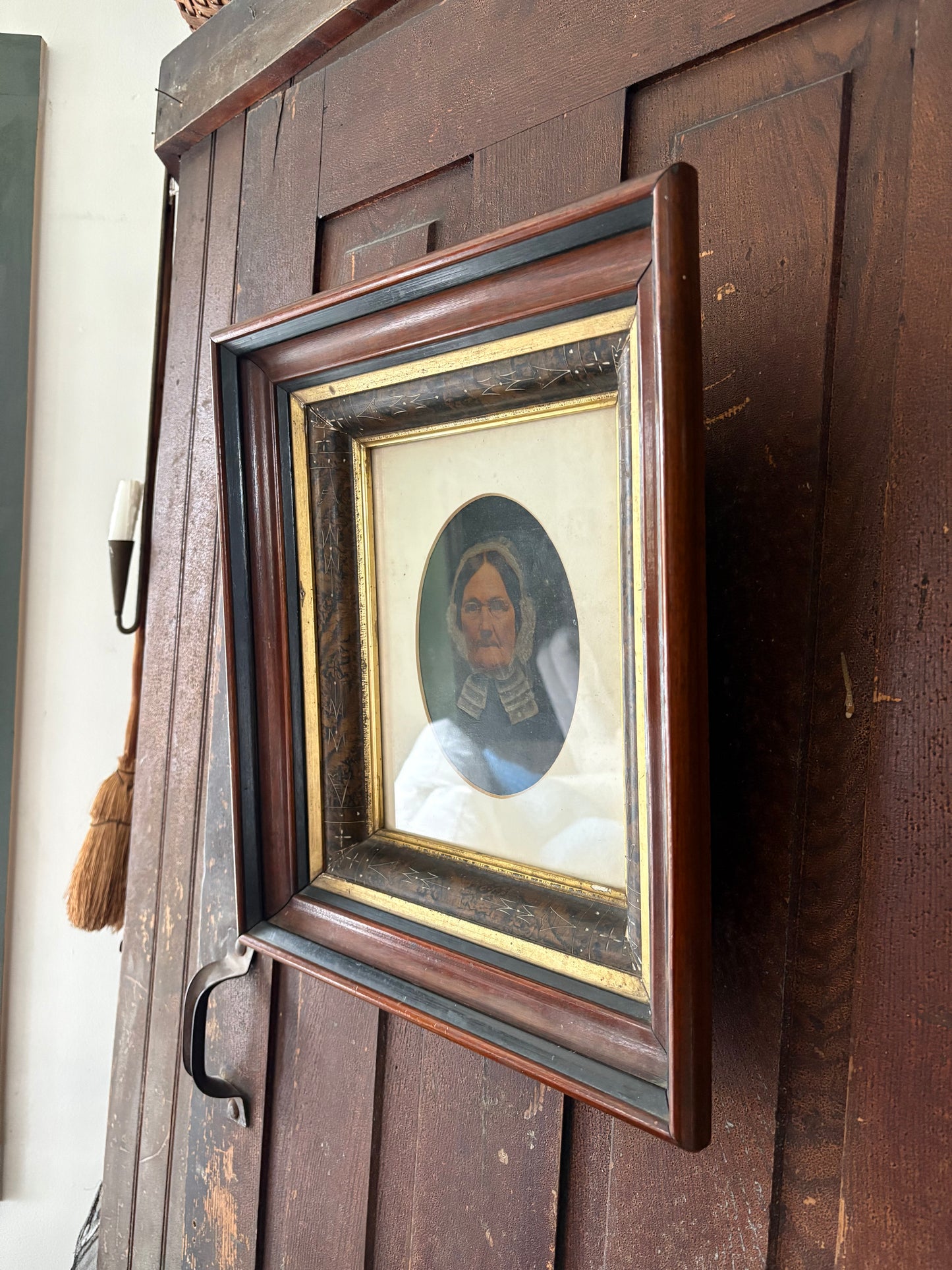 Antique oil painting of woman in frame