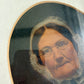 Antique oil painting of woman in frame