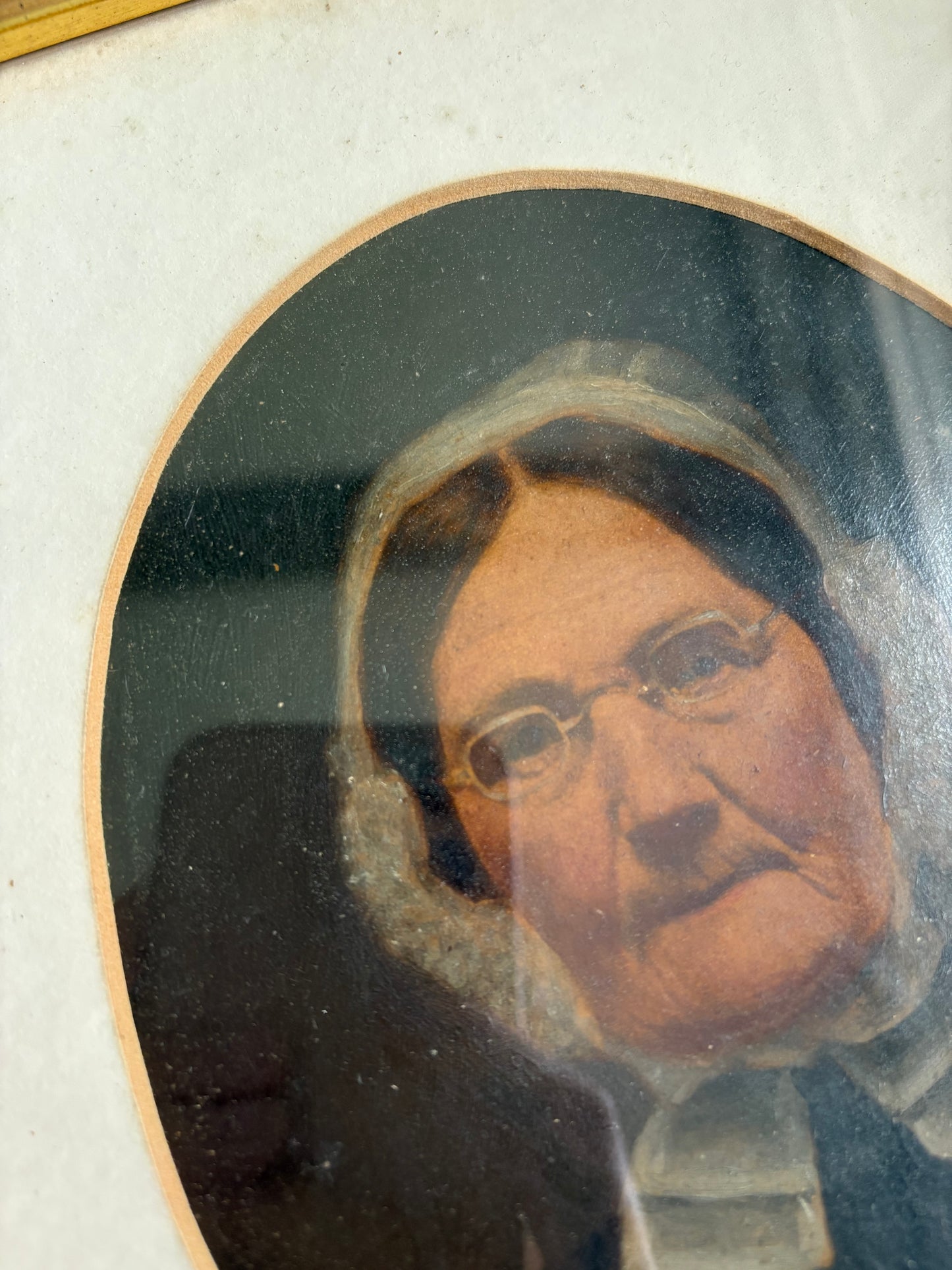 Antique oil painting of woman in frame
