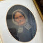 Antique oil painting of woman in frame