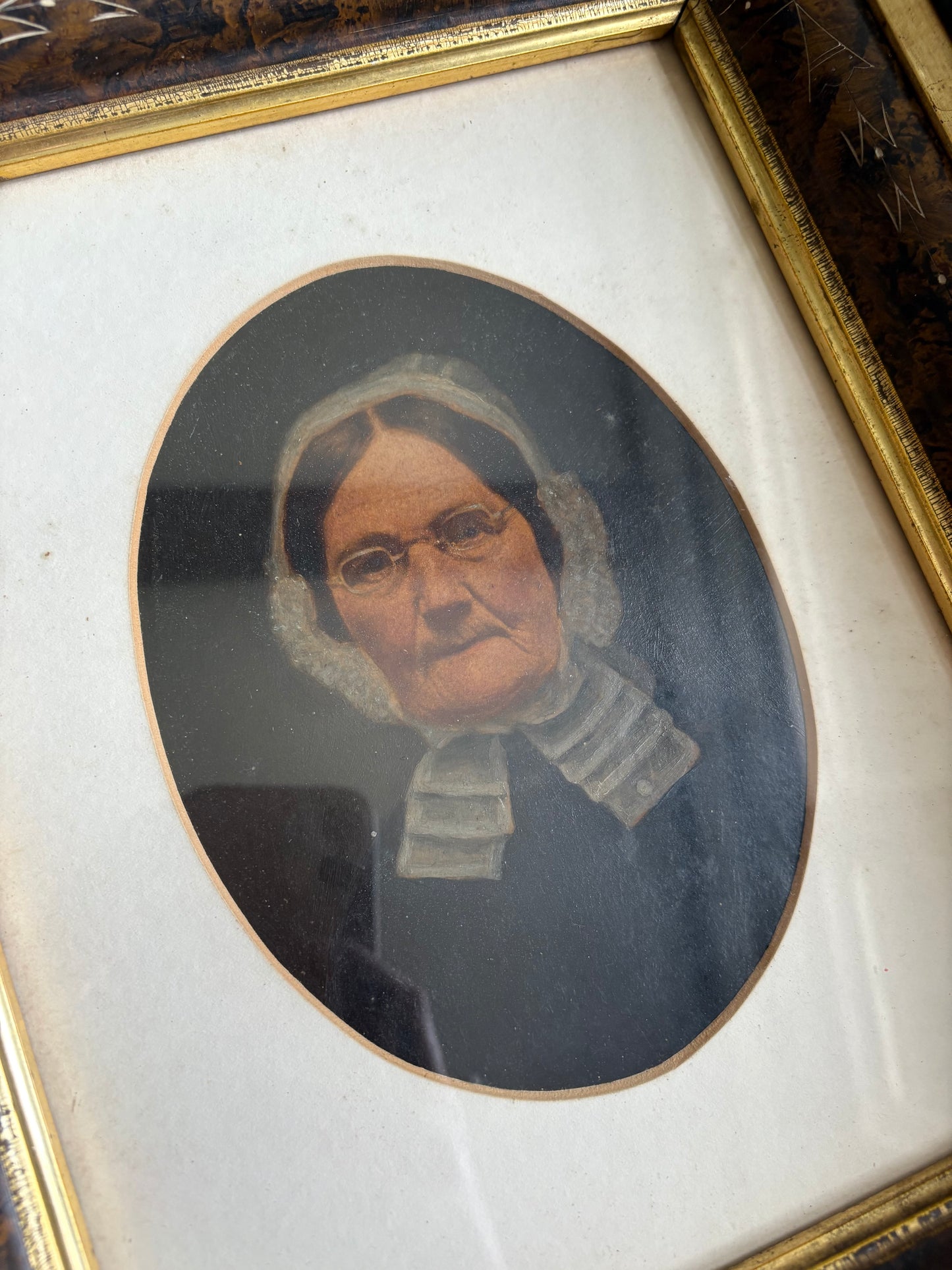 Antique oil painting of woman in frame