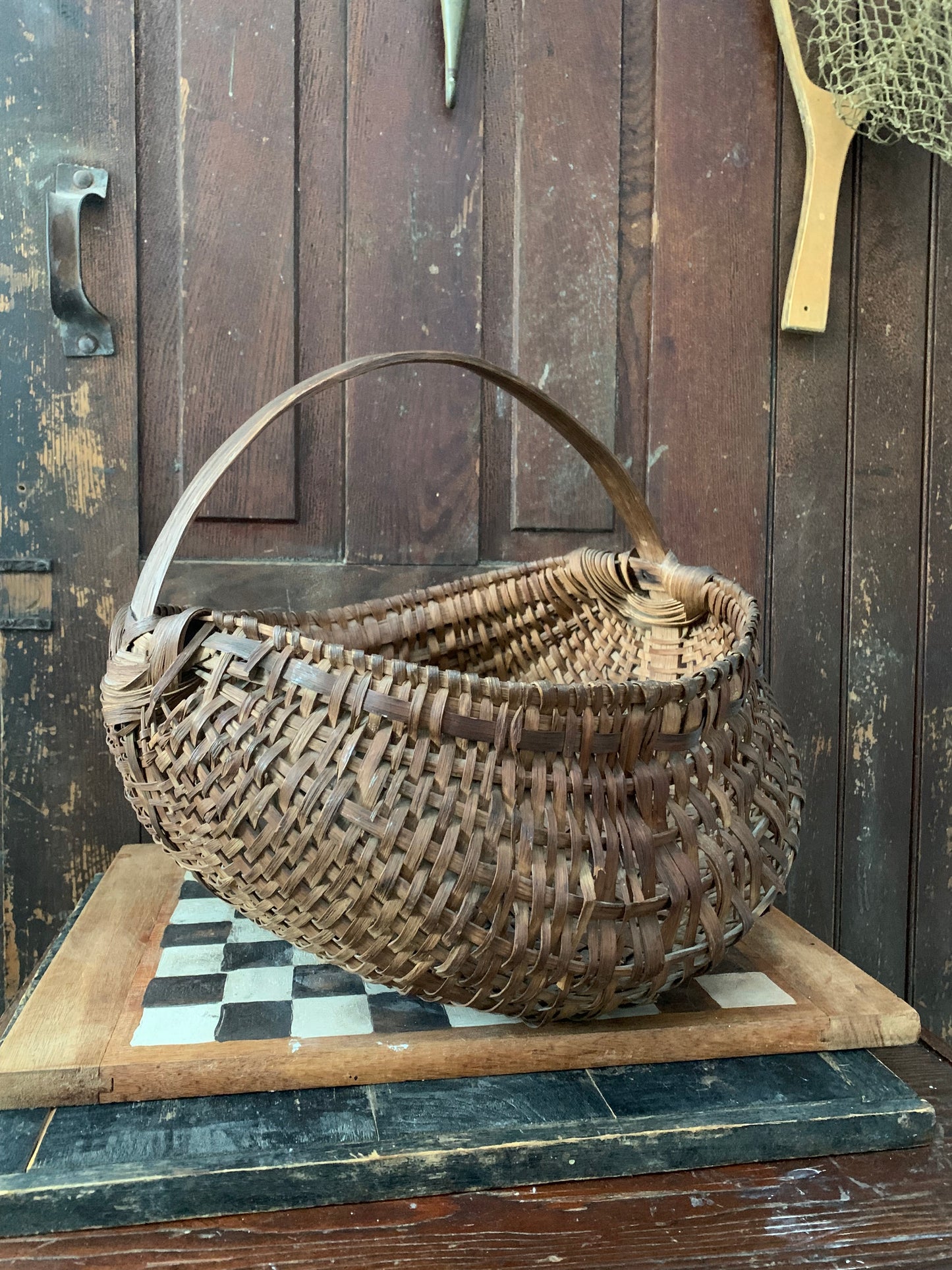 Antique primitive buttocks gathering basket