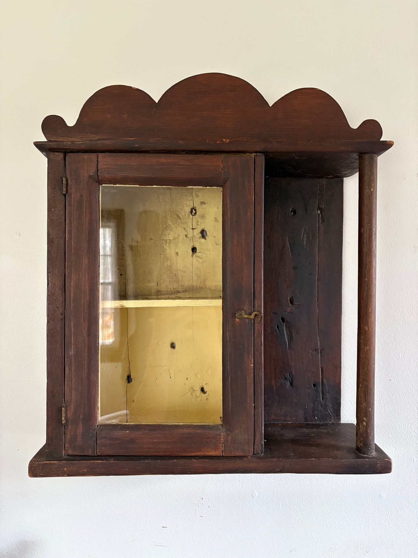 Antique early primitive wall cabinet with scallops