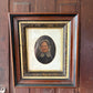 Antique oil painting of woman in frame