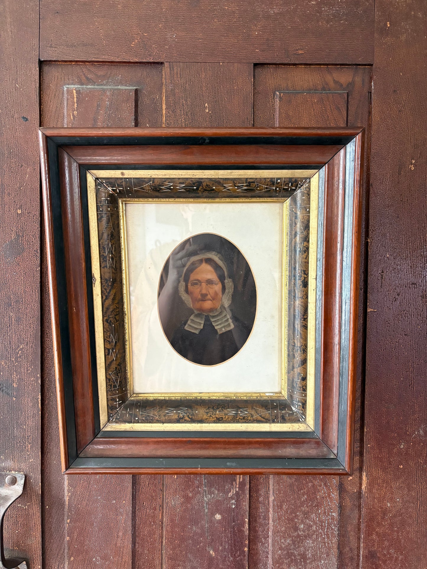 Antique oil painting of woman in frame