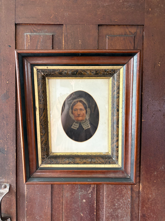 Antique oil painting of woman in frame