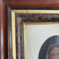 Antique oil painting of woman in frame