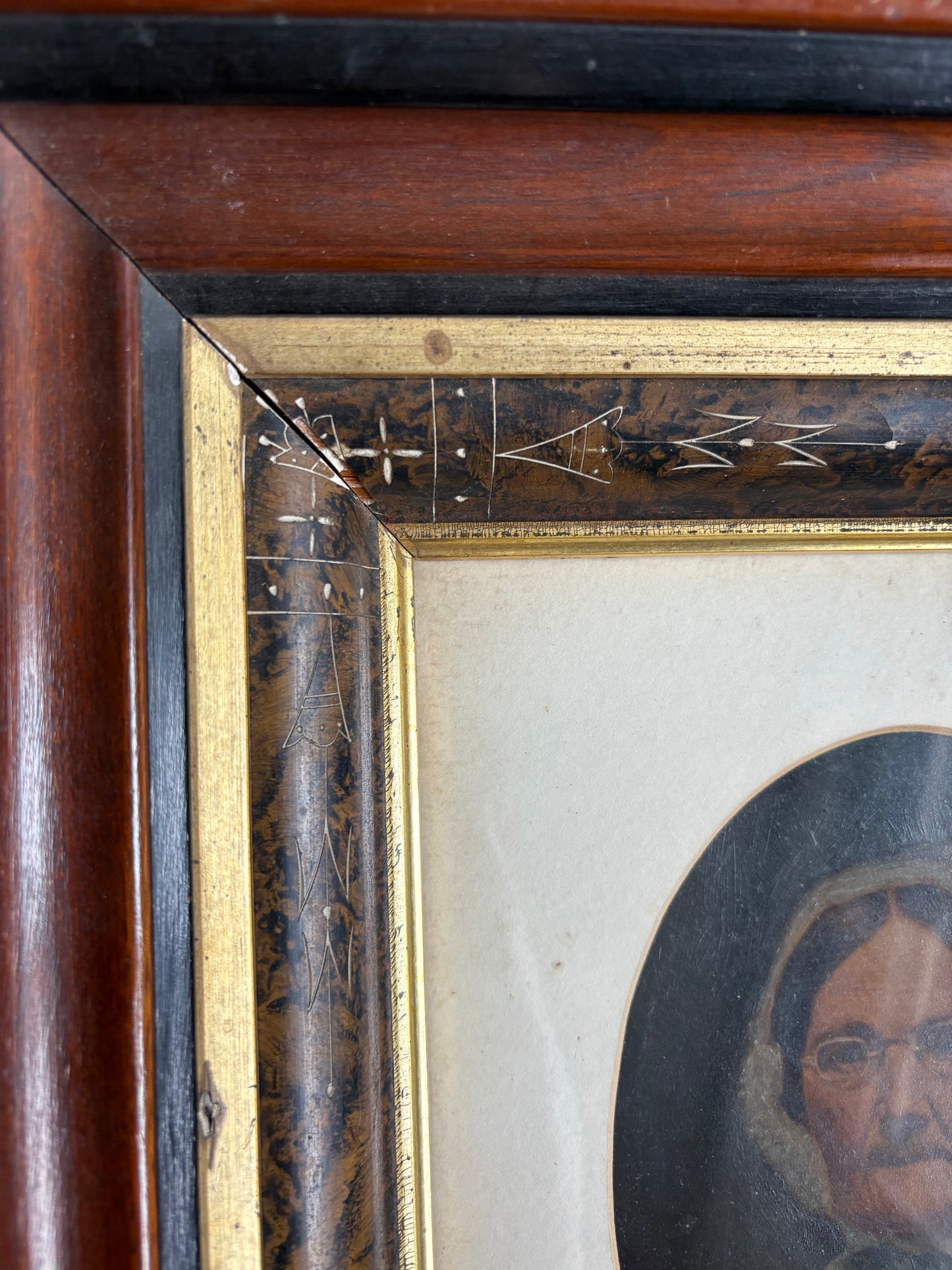 Antique oil painting of woman in frame