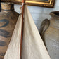 Vintage green wooden sailboat
